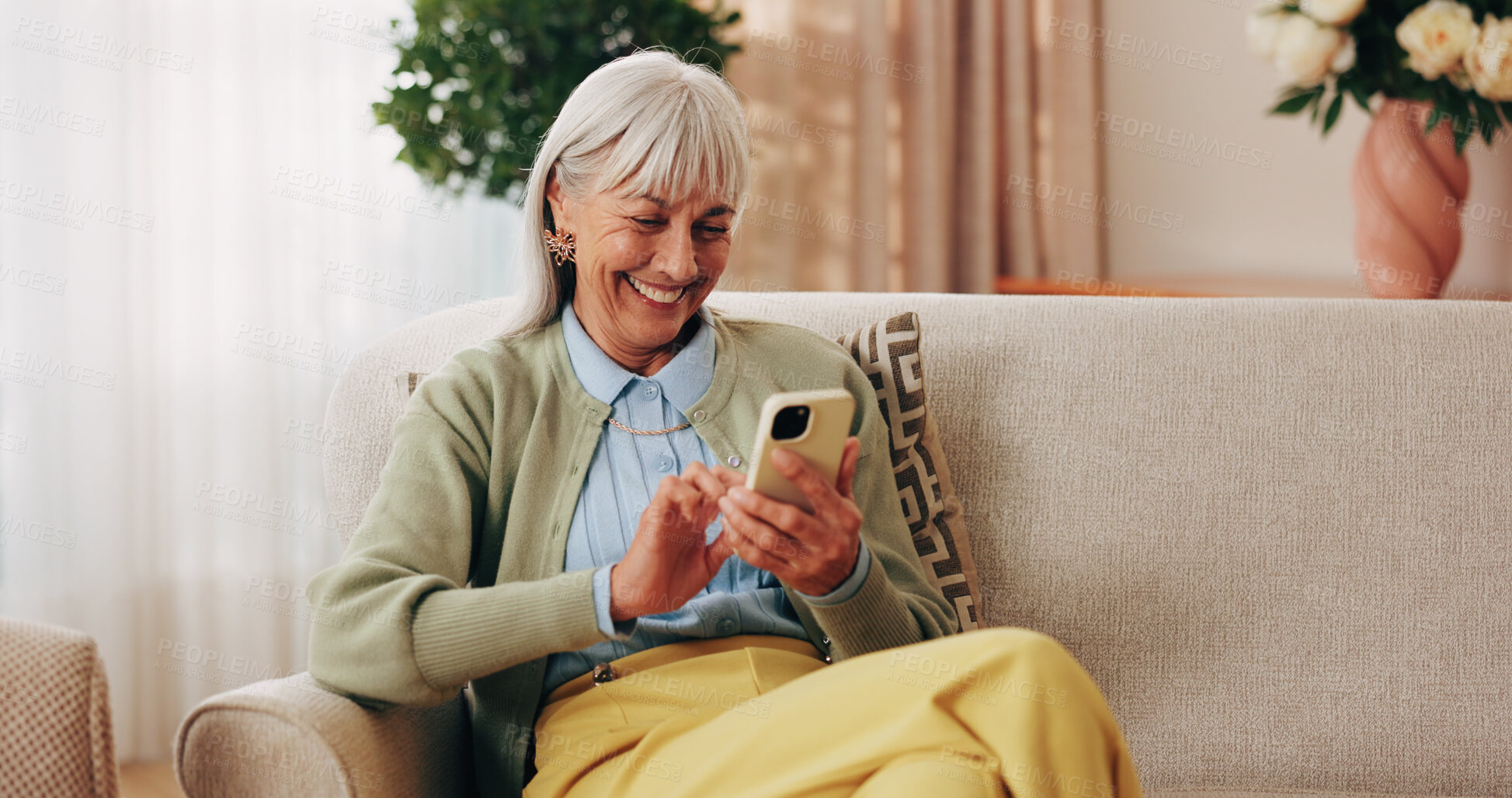 Buy stock photo Happy, sofa and senior woman with phone, social media and connection for online chat on weekend. Retirement, relax and elderly person on mobile app for communication, contact and message in home