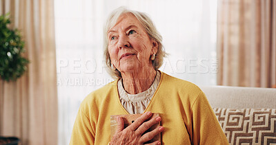 Buy stock photo Thinking, old woman and memory at house with picture frame, remembrance and nostalgia reminder. Smile, reflection and senior person in lounge with photo album, reminiscing moment and mourning loss