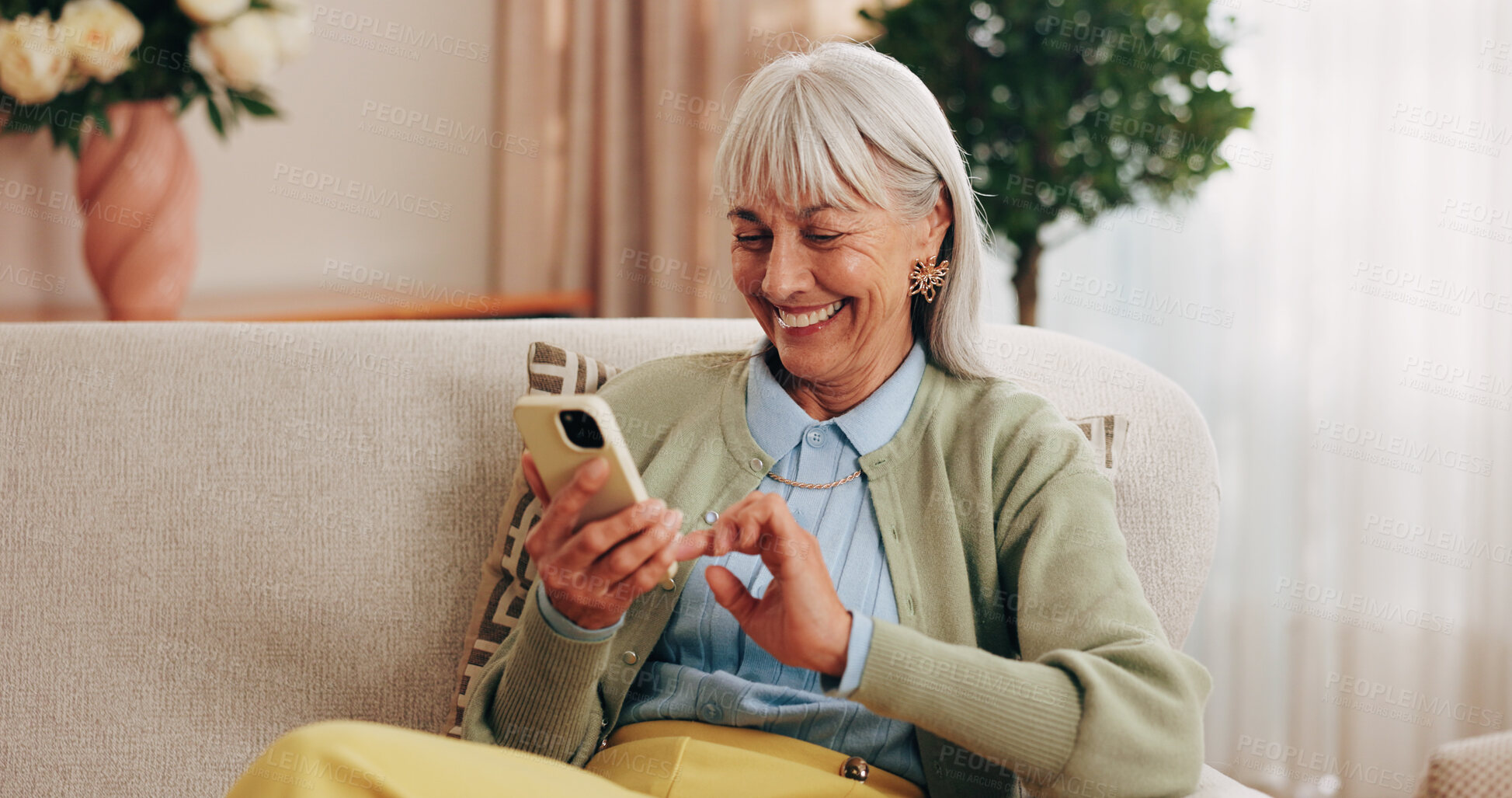 Buy stock photo Relax, sofa and senior woman with phone, social media and connection for online chat on weekend. Retirement, happy and elderly person on mobile app for communication, notification and digital message