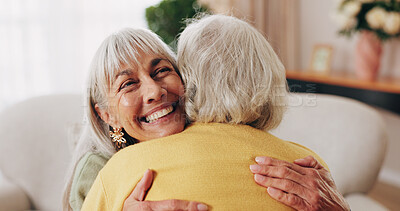 Buy stock photo Friends, hug and support with old women in home for bonding, good news or retirement. Happiness, love and social reunion with senior people in living room for embrace, smile and care in house