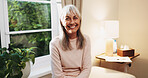 Happy, portrait and senior woman in house, confident and positive attitude on weekend or retirement. Relax, home and mature person with smile on break, chilling and comfortable on peaceful holiday