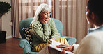 Therapy, sad and senior woman in office for grief counseling, healing and help for mental health. Retirement, psychologist and elderly person with depression, explain trauma and support in session