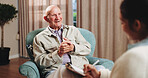 Old man, smile and consultation with psychologist, therapy assessment or rehabilitation results. Senior patient, happy or help with counseling for mental healing, solution or recovery notes at office