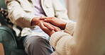 Therapy, people and holding hands for support, care or empathy for mental health in counseling session. Help, comfort and trust with kindness for psychology, compassion or consoling patient in office