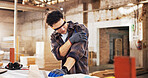 Carpenter, injured and man in workshop with wood for manufacturing, shoulder pain and production. Person, hurt and warehouse with strain for custom or handmade woodworking, dislocation and timber