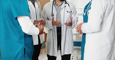 Buy stock photo Team, hands and meeting with doctors in hospital for healthcare, solidarity and consulting. Medical, community and discussion with group of people in hallway of clinic for support and collaboration