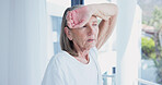 Headache, tired and elderly woman in home with tension, stress and frustrated with discomfort. Pain, fatigue and senior person in lounge with migraine pressure, dizziness and sore head in retirement