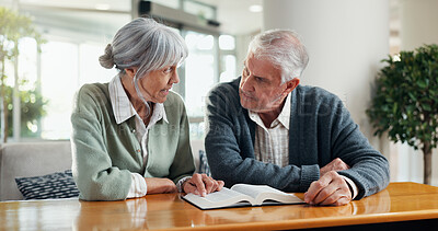 Buy stock photo Discussion, bible and senior couple in home with faith, spiritual wellness or religion in marriage. Conversation, reading and elderly man and woman with holy book for praise, gospel or scripture.