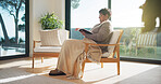 Religion, reading or old woman in house with bible, theology or sacred text with spiritual learning. Christian, review or senior person with holy book, scripture study or wisdom insight in retirement