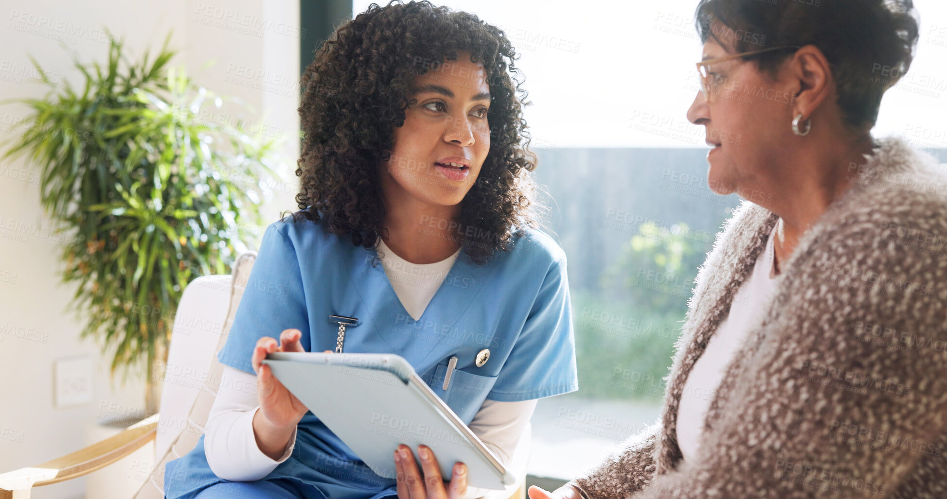 Buy stock photo Senior, woman and caregiver in house with tablet, conversation and medical research for wellness. Nurse, pensioner and person in home with tech, recommendation and feedback for healthcare report.
