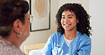 Caregiver, smile and senior woman in retirement home with help, healthcare and good news for wellness. Happy, pensioner and person in living room with nurse, medical support and positive feedback.