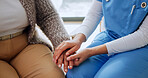 Holding hands, comfort and nurse with senior woman in house for support in medical diagnosis. Checkup, healthcare and caregiver with elderly patient for compassion in treatment at nursing home.