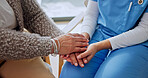 Holding hands, support and nurse with senior woman in house for comfort in medical diagnosis. Checkup, healthcare and caregiver with elderly patient for compassion in treatment at nursing home.