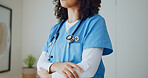 Doctor, hands and arms crossed in office with medical service, cardiology specialist and expertise. Confident, woman and cardiologist in clinic with healthcare experience, work uniform and about us.