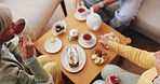 Senior, hands and friends with tea party in house for social gathering, supportive community or chat. Above, people and drink with cake in home for conversation, retirement bonding and weekend visit