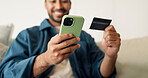 Credit card, hands and man with phone for online shopping, digital purchase and internet banking. Happy, home and person on mobile app with debit info for ecommerce, subscription and website discount