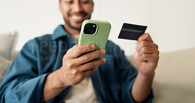 Buy stock photo Credit card, hands and man with phone for online shopping, digital purchase and internet banking. Happy, home and person on mobile app with debit info for ecommerce, subscription and website discount