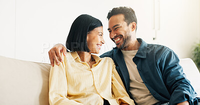 Buy stock photo Happy, relax and couple on sofa in home with bonding, love and connection in marriage on weekend. Smile, trust and man embracing woman in living room for commitment, care and affection in house.