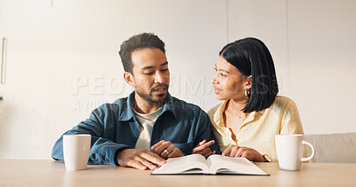 Buy stock photo Couple, talking or Bible study for religion in home, coffee and scripture discussion with faith. People, book or learn Christianity for worship, bonding and gospel conversation for spiritual growth