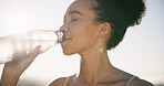 Fitness, break and woman drink water outdoor with electrolytes, workout and healthy habits for wellness. Active, female person and hydration with beverage for thirst, training and exercise recovery.
