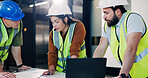 Construction, laptop and meeting with architect team in office for maintenance or planning. Blueprint, collaboration and computer with engineering people in workplace for project management update