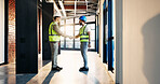 Happy, architect and men in building, handshake and agreement for property development and teamwork. Civil engineering, discussion and people with smile for renovation, shaking hands or collaboration
