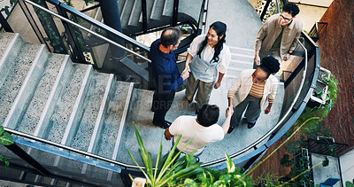 Buy stock photo Business, welcome or people in office with handshake, partnership or networking in b2b greeting. Happy, above or employees on stairs with shaking hands, opportunity or introduction with collaboration