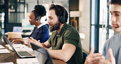Buy stock photo Headset, laptop and technical support consultant in office for crm, help desk or online consultation. Man, coworking and call center agent in workplace with enquiry, contact us or customer service.
