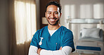 Happy, crossed arms and portrait of nurse in hospital with confidence for career in medical support. Man, professional and healthcare worker with pride for about us with service at clinic in Colombia