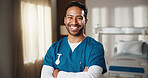 Medical, portrait and nurse in hospital with arms crossed, clinical service or pride as physician career. Happy, man or doctor with confidence, general practitioner or about us in healthcare industry