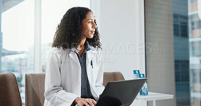 Buy stock photo Thinking, doctor and woman with laptop in hospital for healthcare insight, problem solving or ponder. Computer, clinic professional and person planning with medical idea, vision and admin decision