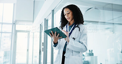 Buy stock photo Medical, doctor and woman with tablet for research, schedule or reading patient history in hospital. Technology, female person and healthcare professional with records, space and assessment report