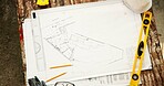 Construction, above and drawing for blueprint with stationery outdoor, civil engineering or architecture. Floor plan, sketch and workspace with ruler, level and expansion design with layout lines