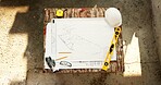 Construction, top view and drawing for blueprint with stationery outdoor, civil engineering or architecture. Floor plan, sketch and workspace with ruler, level and expansion design with layout lines
