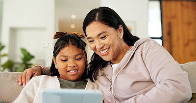 Buy stock photo Tablet, happy and mother with kid on sofa in home for playing educational game on app together. Smile, digital technology and mom with girl child for online gaming with learning in apartment.