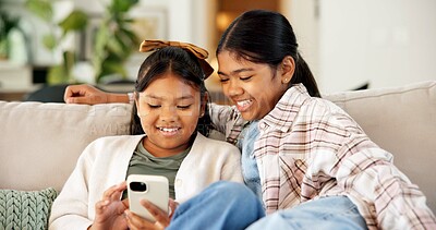 Buy stock photo Children, sisters and game in home with phone, entertainment and bonding together on weekend break. Happy, kids and siblings relax in living room with tech, gaming website and internet connectivity.