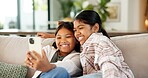 Children, relax and sofa with selfie in home for weekend, bonding or capture moment together. Girls, sisters or siblings with smile or app for photography, holiday picture or memory on couch in house