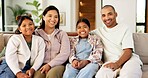 Family, portrait and relax with children on sofa for weekend, bonding or time together in home. Mom, dad and kids with smile, childhood or protection for holiday, vacation or parenthood in house