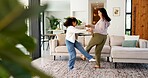 Happy, mom and dancing with child in home for bonding, weekend or fun energy together. Mother, girl or daughter holding hands with playful kid for vibe, holiday celebration or vacation in house
