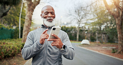 Buy stock photo Fitness, phone and senior man with music outdoor for wellness playlist, podcast and smile. Mobile, happy runner and black person with earphones for exercise audio, space and active retirement