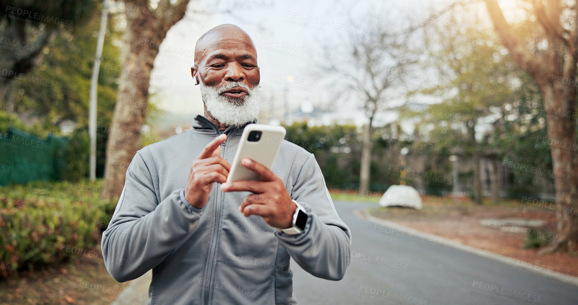 Buy stock photo Fitness, phone and senior man with music outdoor for wellness playlist, podcast and smile. Mobile, happy runner and black person with earphones for exercise audio, space and active retirement