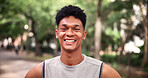 Fitness, portrait and smile with man outdoor in park for start of cardio training or workout. Commitment, exercise and morning with happy runner in nature for challenge, dedication or health