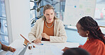 Woman, meeting and documents with team for business analytics or statistics in office. Female person, employee or discussion with colleagues for performance review, finance or revenue in workplace
