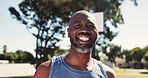 Pride, portrait or black man on basketball court with smile, fitness hobby or practice on weekend break. Active, happy or mature person with confidence, hoop sport or training session in outdoor game