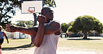 Exercise, park and stretching with man on basketball court for game, practice or training. Fitness, start and warm up with sport athlete getting ready for competition, workout or performance outdoor