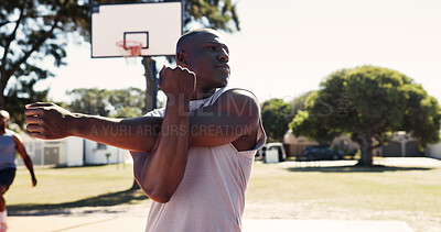 Buy stock photo Exercise, park and stretching with man on basketball court for game, practice or training. Fitness, start and warm up with sport athlete getting ready for competition, workout or performance outdoor