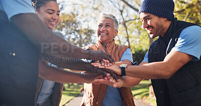 Buy stock photo Volunteer, people and hands together for unity outdoor, happy with support and charity for outreach. Team building, smile and group stack with community service, mission and social responsibility
