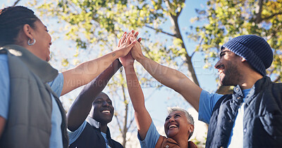 Buy stock photo Volunteer, people and high five for unity outdoor, happy with support and charity together. Team building, smile and below group with community hands for outreach, mission and social responsibility