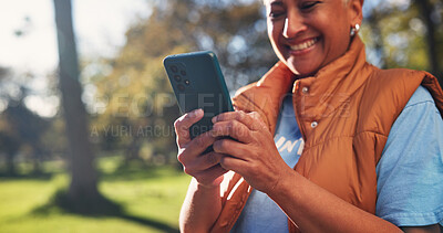 Buy stock photo Cellphone, woman and volunteer in nature for email feedback on community outreach or NGO project. Happy, outdoor and mature charity worker with phone for texting of contact for non profit update.