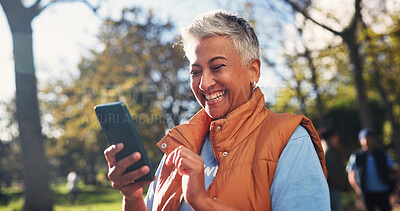 Buy stock photo Phone, woman and volunteer in nature for email feedback on community outreach or NGO project. Happy, outdoor and mature charity worker with cellphone for texting of contact for non profit update.
